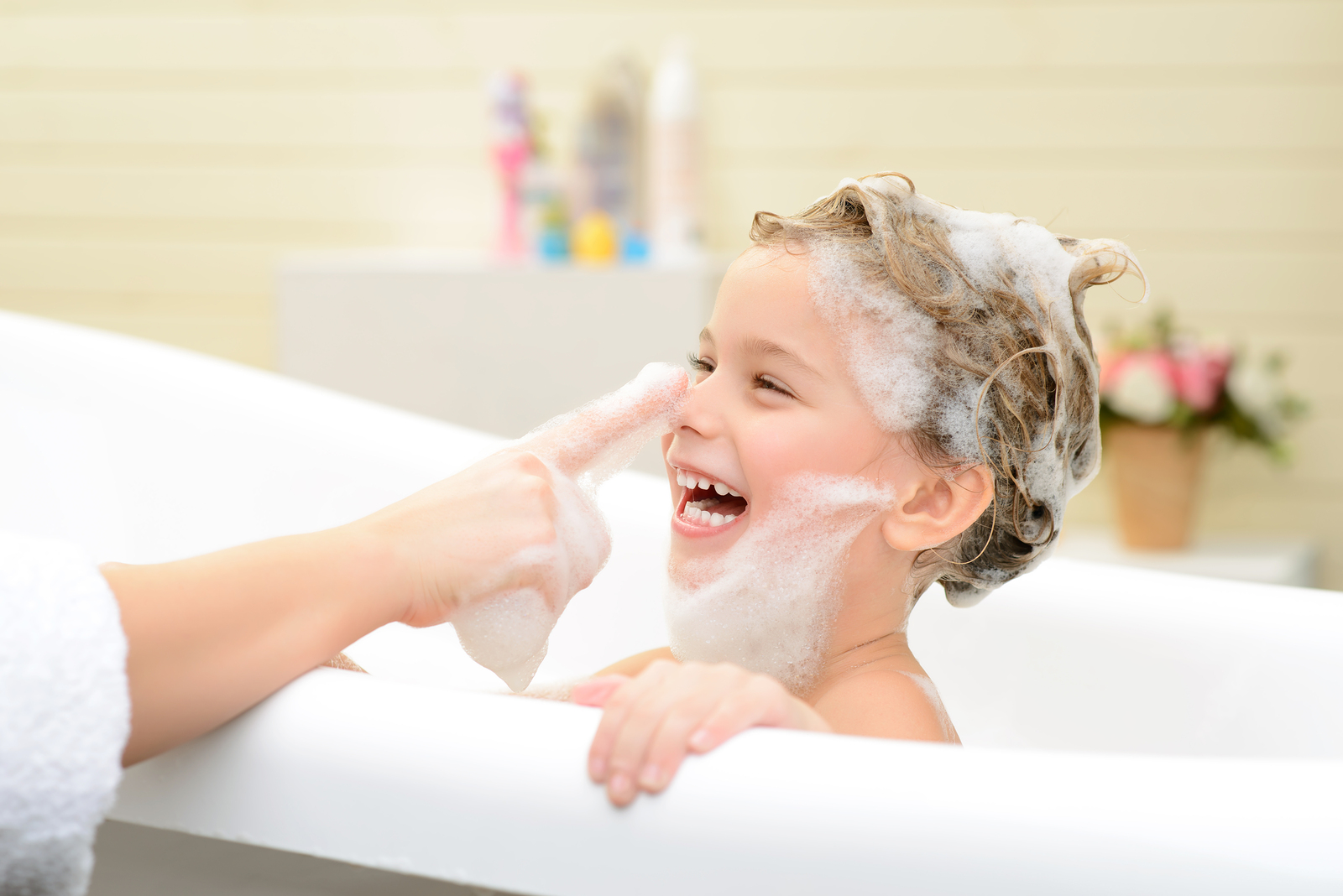 Cute little girl washing her hair